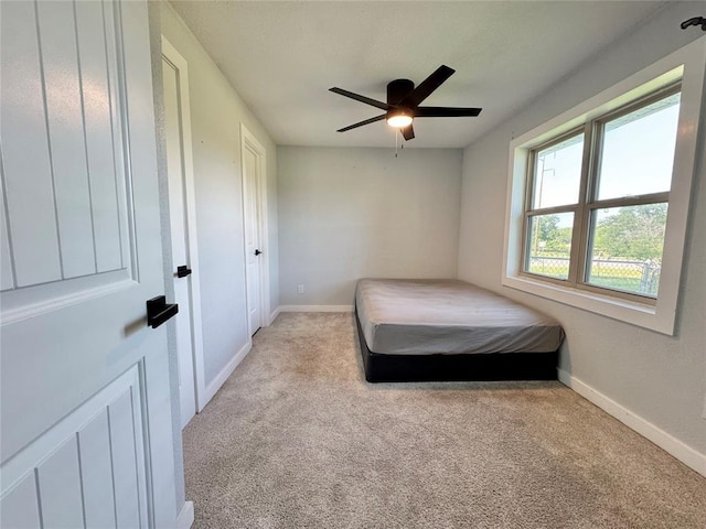 1304 W Walnut St, Tecumseh, OK 74873 - bedroom featuring light carpet and a ceiling fan