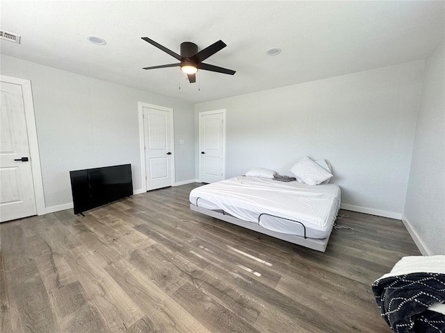 1304 W Walnut St, Tecumseh, OK 74873 - bedroom featuring wood finished floors and ceiling fan