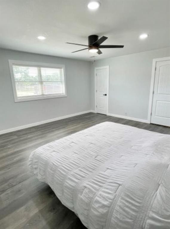 1304 W Walnut St, Tecumseh, OK 74873 - bedroom featuring dark wood-style floors, recessed lighting, and a ceiling fan