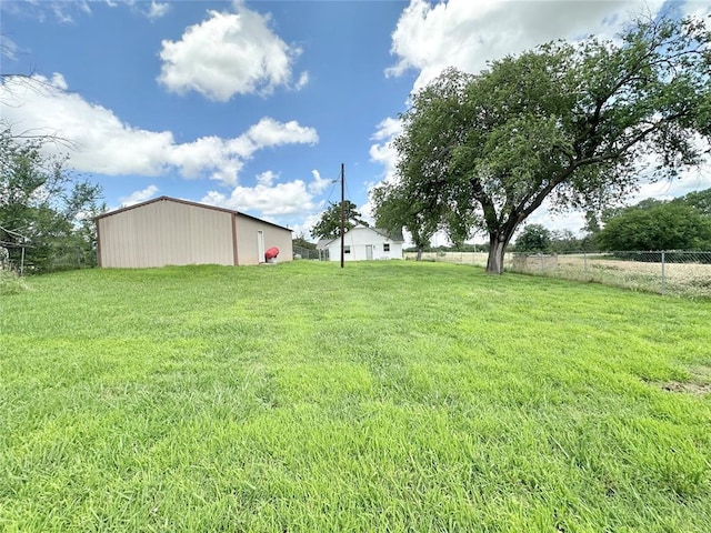 1304 W Walnut St, Tecumseh, OK 74873 - view of yard featuring a pole building and an outbuilding