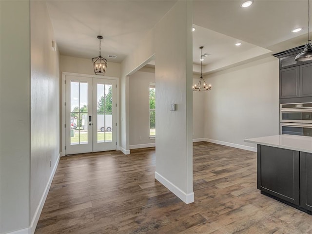 5812 Cimarron Mnr, Guthrie, OK 73044 - foyer entrance featuring a chandelier, french doors, dark wood-style floors, and recessed lighting