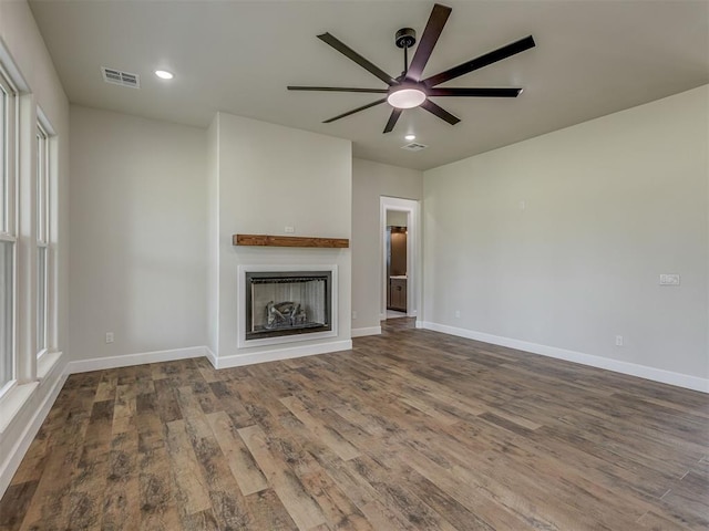 5812 Cimarron Mnr, Guthrie, OK 73044 - unfurnished living room with a ceiling fan, wood finished floors, a fireplace, and recessed lighting