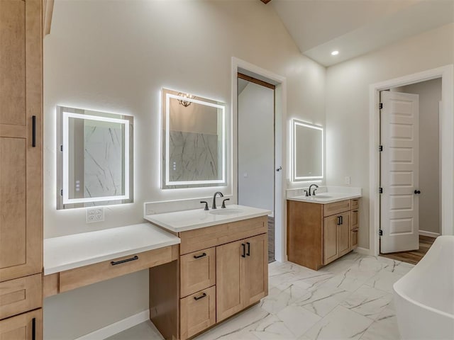5812 Cimarron Mnr, Guthrie, OK 73044 - full bathroom with a freestanding tub, two vanities, marble look tile flooring, vaulted ceiling, and recessed lighting