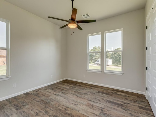 5812 Cimarron Mnr, Guthrie, OK 73044 - empty room featuring ceiling fan and dark wood finished floors