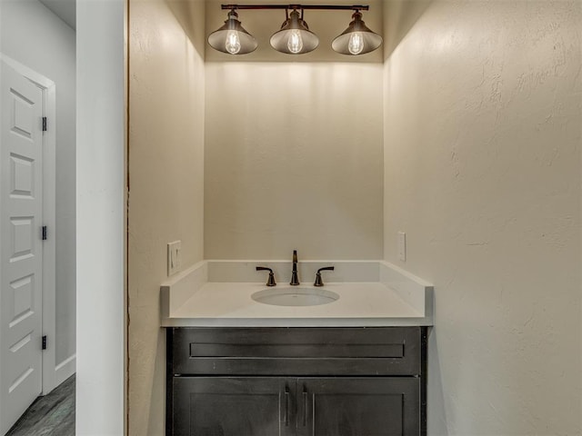 5812 Cimarron Mnr, Guthrie, OK 73044 - bathroom featuring vanity and wood finished floors