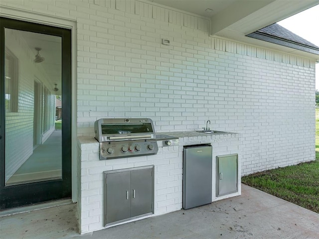 5812 Cimarron Mnr, Guthrie, OK 73044 - view of patio / terrace featuring an outdoor kitchen