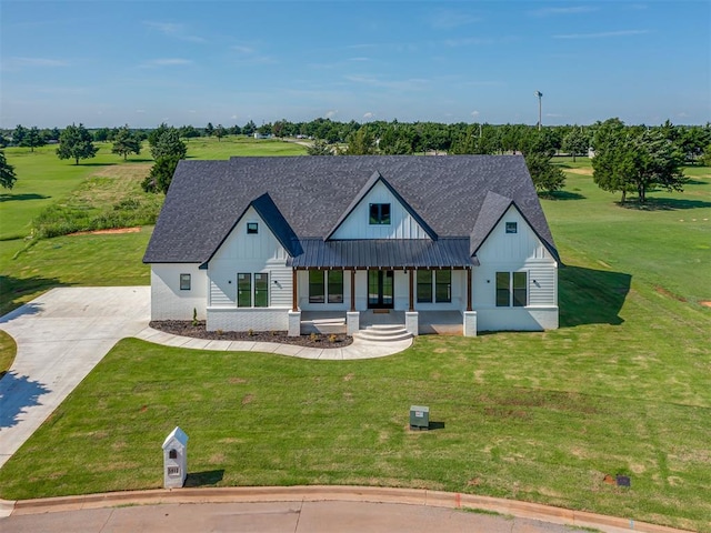 5812 Cimarron Mnr, Guthrie, OK 73044 - modern farmhouse style home with covered porch, roof with shingles, and a front yard