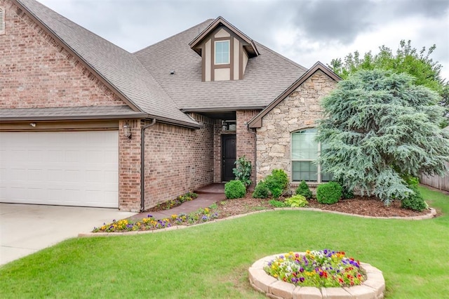 328 SW 175th Ter, Oklahoma City, OK 73170 - view of front facade with a shingled roof, a front lawn, brick siding, and an attached garage