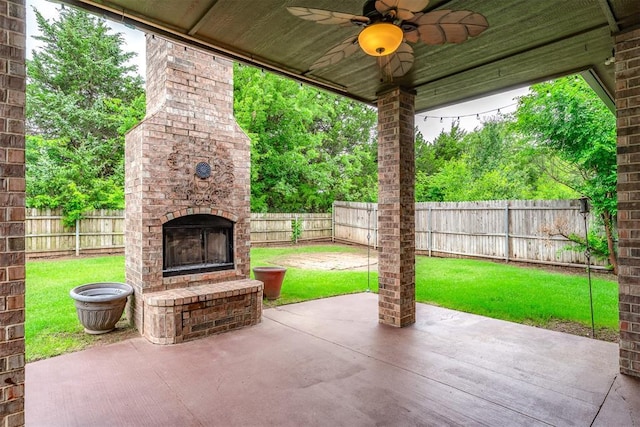 328 SW 175th Ter, Oklahoma City, OK 73170 - view of patio featuring an outdoor brick fireplace and a ceiling fan