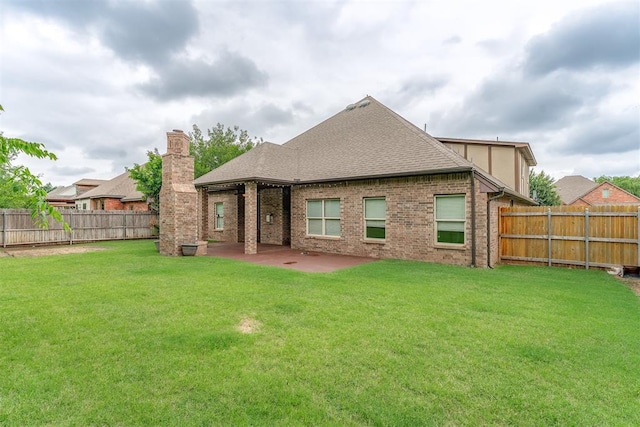 328 SW 175th Ter, Oklahoma City, OK 73170 - back of property with a patio area, roof with shingles, a chimney, and brick siding
