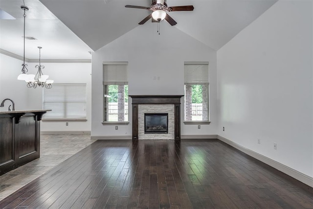 328 SW 175th Ter, Oklahoma City, OK 73170 - unfurnished living room with ceiling fan, plenty of natural light, dark wood-style flooring, and high vaulted ceiling