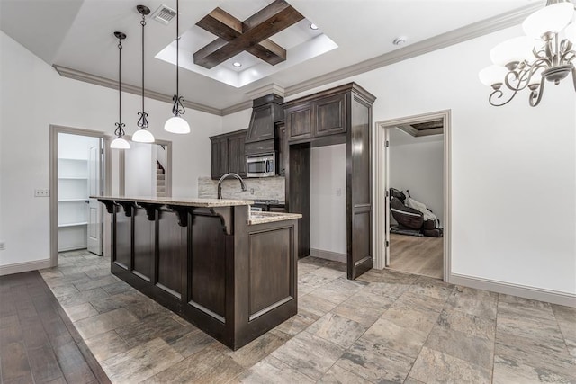 328 SW 175th Ter, Oklahoma City, OK 73170 - kitchen featuring stainless steel microwave, coffered ceiling, baseboards, dark brown cabinetry, and crown molding