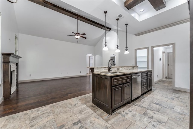 328 SW 175th Ter, Oklahoma City, OK 73170 - kitchen with dishwasher, a sink, baseboards, ceiling fan, and a fireplace