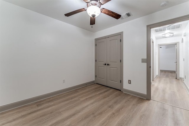 328 SW 175th Ter, Oklahoma City, OK 73170 - unfurnished bedroom with light wood-type flooring, baseboards, a closet, and a ceiling fan