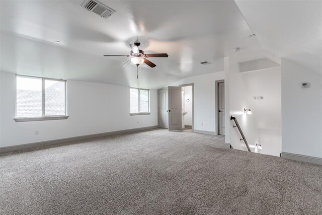 328 SW 175th Ter, Oklahoma City, OK 73170 - unfurnished room with a ceiling fan, light carpet, lofted ceiling, and baseboards