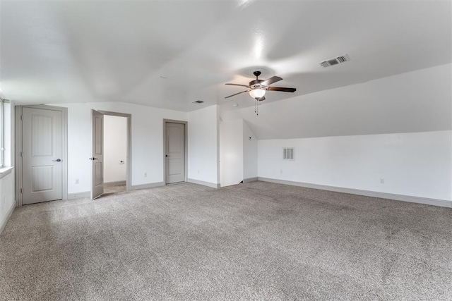 328 SW 175th Ter, Oklahoma City, OK 73170 - additional living space with a ceiling fan, lofted ceiling, light colored carpet, and baseboards