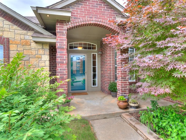 113 Stone Creek Dr, Midwest City, OK 73130 - view of exterior entry featuring stone siding and brick siding