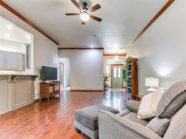 113 Stone Creek Dr, Midwest City, OK 73130 - living area with ornamental molding, ceiling fan, hardwood / wood-style floors, and baseboards