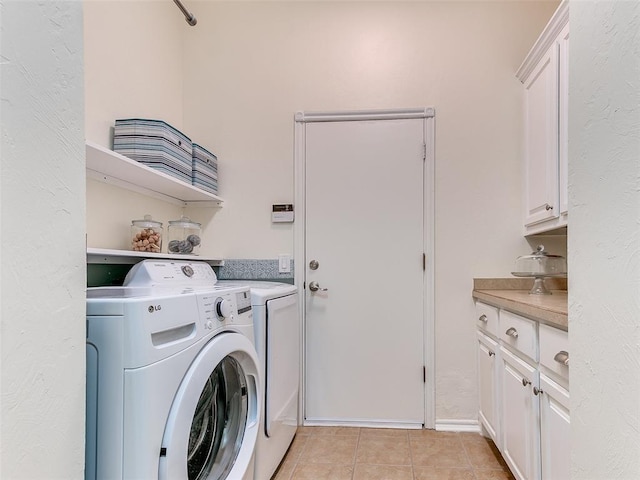 113 Stone Creek Dr, Midwest City, OK 73130 - washroom featuring independent washer and dryer, cabinet space, and light tile patterned flooring