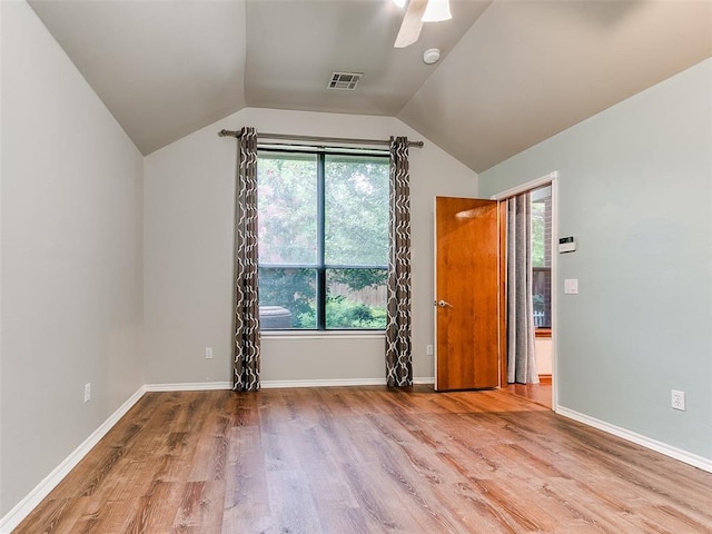 113 Stone Creek Dr, Midwest City, OK 73130 - unfurnished bedroom featuring wood finished floors, lofted ceiling, ceiling fan, and baseboards