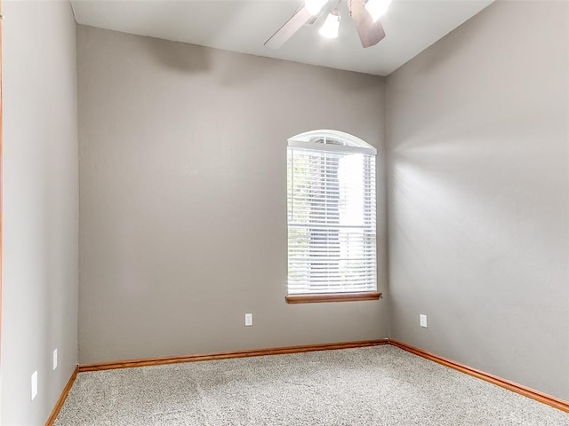 113 Stone Creek Dr, Midwest City, OK 73130 - spare room featuring carpet flooring, baseboards, and a ceiling fan