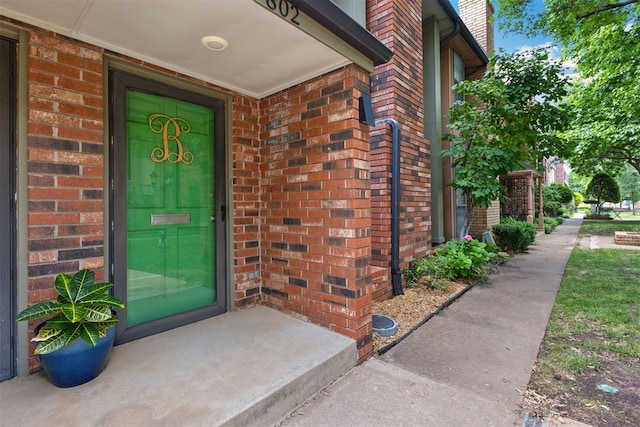 7802 Old Hickory Ln, Oklahoma City, OK 73116 - doorway to property with brick siding and a chimney
