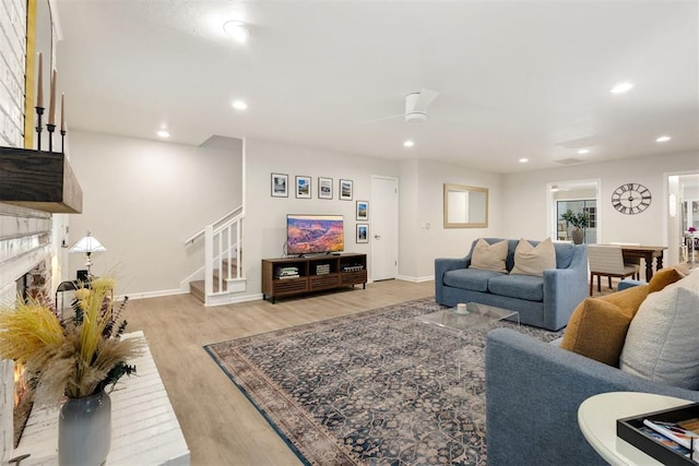 7802 Old Hickory Ln, Oklahoma City, OK 73116 - living area featuring light wood-style flooring, stairway, baseboards, recessed lighting, and a brick fireplace