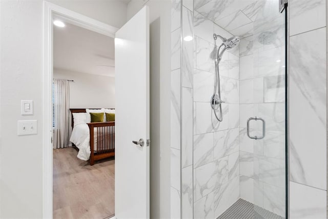 7802 Old Hickory Ln, Oklahoma City, OK 73116 - ensuite bathroom with a shower stall and wood finished floors