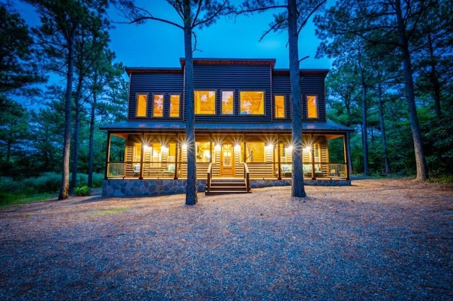 59 Sweet Elm, Broken Bow, OK 74728 - back of house featuring a porch and metal roof
