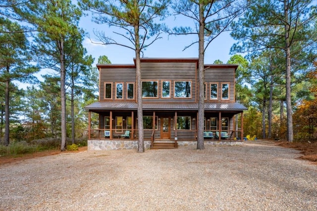 59 Sweet Elm, Broken Bow, OK 74728 - view of front facade featuring covered porch, metal roof, and faux log siding