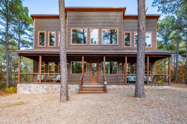 59 Sweet Elm, Broken Bow, OK 74728 - view of front of property with covered porch and log veneer siding