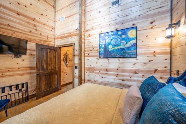 59 Sweet Elm, Broken Bow, OK 74728 - bedroom with wood walls and concrete floors