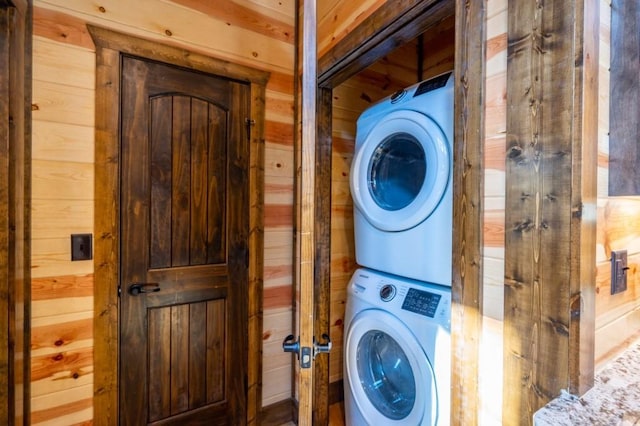 59 Sweet Elm, Broken Bow, OK 74728 - washroom featuring stacked washer / drying machine and wooden walls
