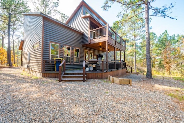 59 Sweet Elm, Broken Bow, OK 74728 - back of house featuring faux log siding, a balcony, and a deck