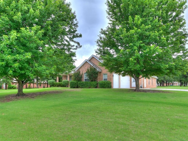16441 Roserock Cir, Choctaw, OK 73020 - view of green lawn featuring a garage