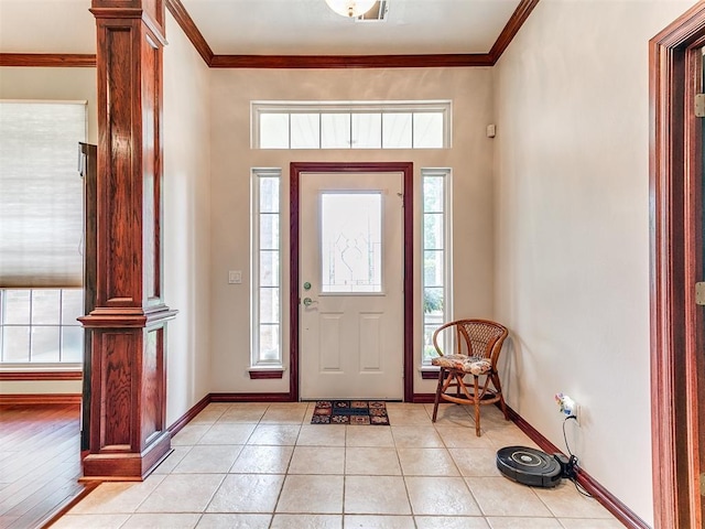 16441 Roserock Cir, Choctaw, OK 73020 - foyer entrance with ornamental molding, plenty of natural light, baseboards, light tile patterned flooring, and ornate columns