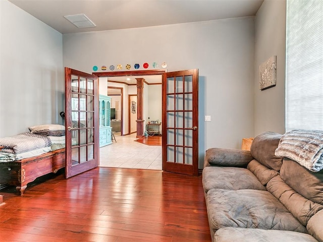 16441 Roserock Cir, Choctaw, OK 73020 - living room featuring french doors and hardwood / wood-style floors