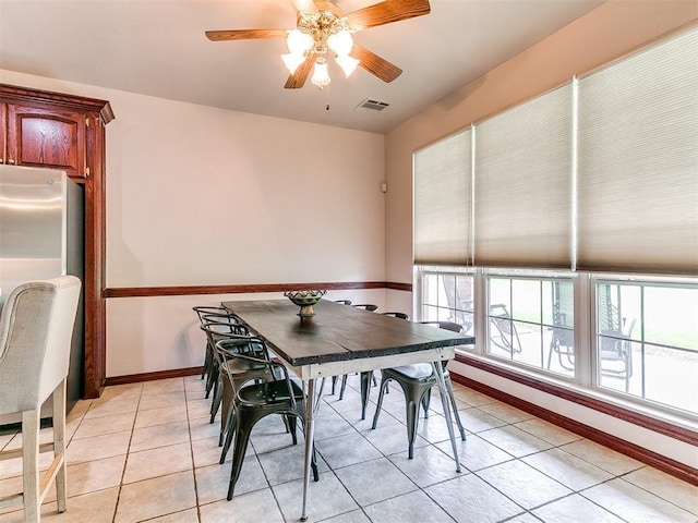 16441 Roserock Cir, Choctaw, OK 73020 - dining space with light tile patterned floors, ceiling fan, and baseboards