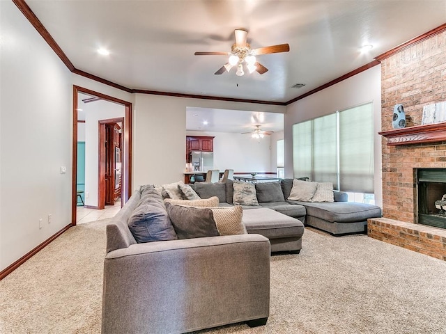 16441 Roserock Cir, Choctaw, OK 73020 - living area with light carpet, ceiling fan, crown molding, a brick fireplace, and baseboards