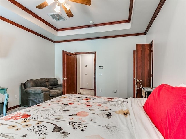 16441 Roserock Cir, Choctaw, OK 73020 - bedroom featuring carpet flooring, ornamental molding, a tray ceiling, baseboards, and a ceiling fan