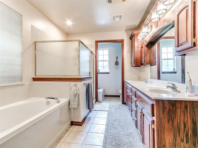 16441 Roserock Cir, Choctaw, OK 73020 - bathroom with toilet, double vanity, a bath, tile patterned flooring, and a stall shower