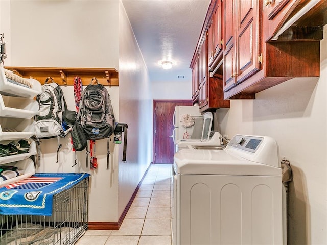 16441 Roserock Cir, Choctaw, OK 73020 - laundry area with washer and dryer, light tile patterned floors, and cabinet space