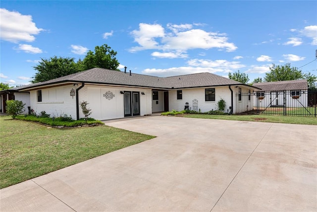 1113 Winnipeg Dr, Yukon, OK 73099 - view of front of home featuring brick siding, driveway, and roof with shingles