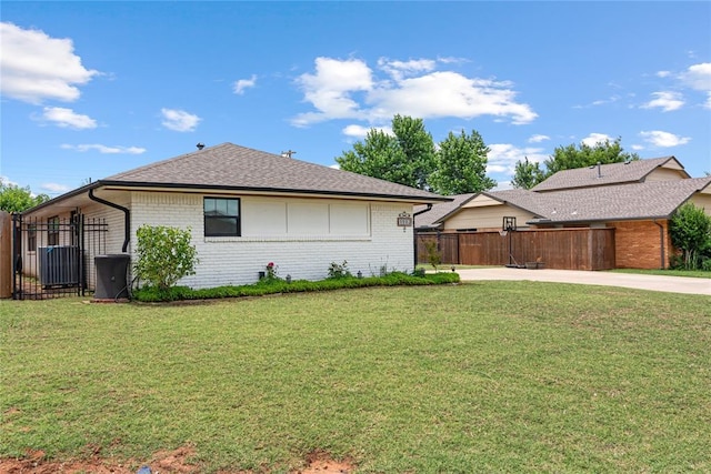 1113 Winnipeg Dr, Yukon, OK 73099 - view of side of property featuring brick siding and a shingled roof