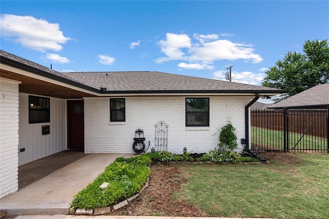 1113 Winnipeg Dr, Yukon, OK 73099 - back of property with brick siding and roof with shingles