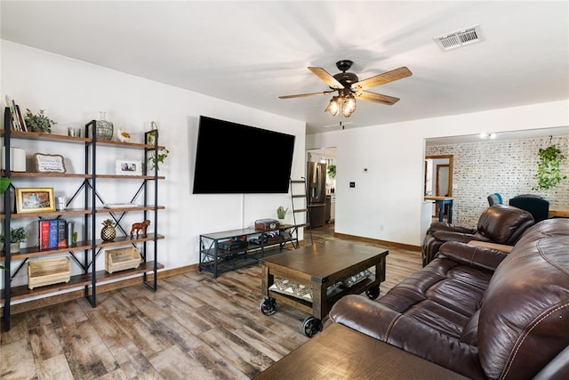 1113 Winnipeg Dr, Yukon, OK 73099 - living area with a ceiling fan, baseboards, and wood finished floors