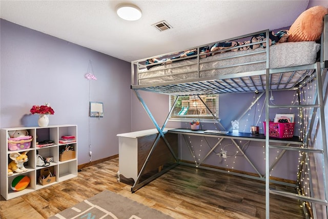 1113 Winnipeg Dr, Yukon, OK 73099 - bedroom with wood finished floors and baseboards