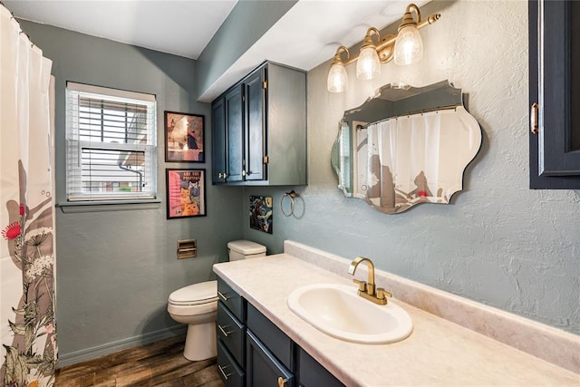 1113 Winnipeg Dr, Yukon, OK 73099 - full bathroom with wood finished floors, toilet, vanity, baseboards, and a shower with shower curtain