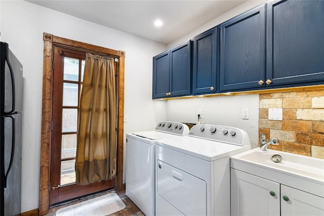1113 Winnipeg Dr, Yukon, OK 73099 - laundry area featuring washing machine and dryer and cabinet space