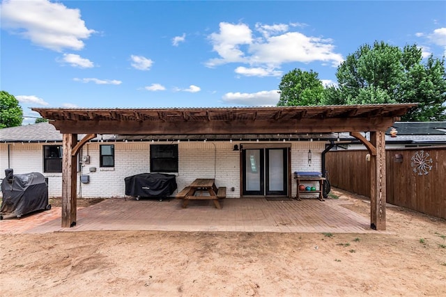 1113 Winnipeg Dr, Yukon, OK 73099 - back of house with brick siding, a patio area, and a pergola
